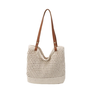 Borsa tote in paglia intrecciata beige con manici in pelle marrone per vacanze al mare