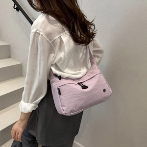 Minimalist light purple nylon tote bag with drawstring zipper detail for daily commute