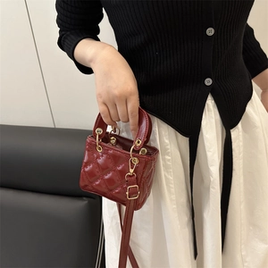 Red mini patent leather crossbody bag with classic quilted pattern and gold hardware