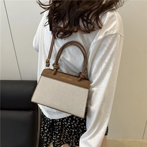 Chic cream canvas and brown leather crossbody bag with knot handle and fashion print