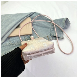 Detailed shot of pink satin mobile phone bag with traditional Chinese pavilion embroidery