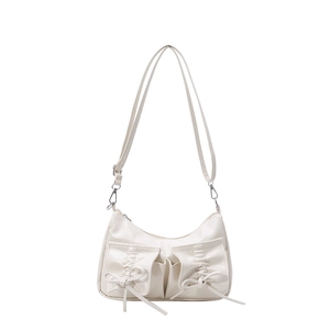 White crescent PU leather shoulder bag with decorative bows and pleated front pockets