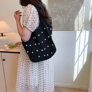 Large black woven tote bag with colorful pearls for casual commute or beach vacation