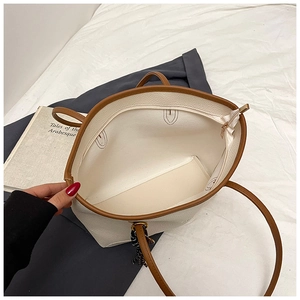 Top view showing the spacious interior and zipper closure of the white tote bag
