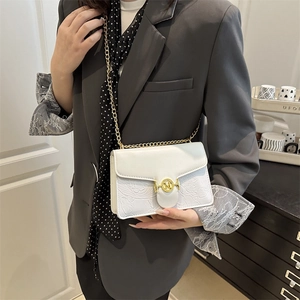 Elegant white crossbody bag with floral embossing and gold M-logo chain strap