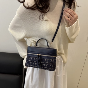 Navy blue tweed box handbag with gold zippers and adjustable shoulder strap for women