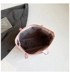 Top view of pink tote bag showing spacious interior with zipper and decorative lining
