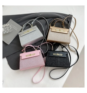 Top view of sequined crossbody bags in silver, gold, pink and black with metal clasps