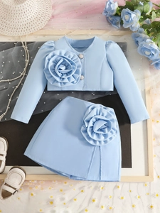 Girl's summer two-piece set featuring light blue floral long sleeve top and mini skirt