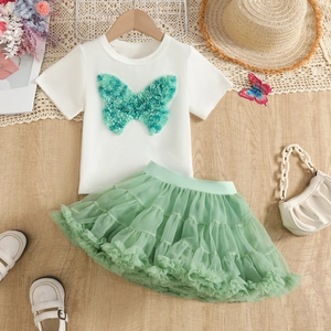 Close-up of white t-shirt with 3D green mesh butterfly and matching mint tutu skirt