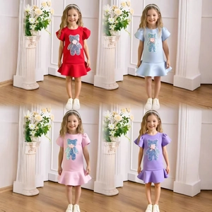 Detail view of girl's puff sleeve princess dress with sequin bear motif in four colors