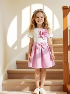 Girls sweet two-piece outfit featuring 3D floral white top and pink pleated bow skirt