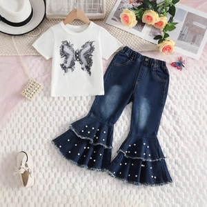 Detail of flared denim jeans with pearl embellishments and ruffled hem for girls' set