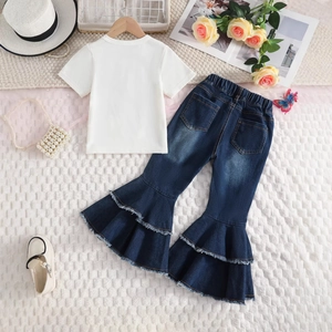 Flat lay of white cotton t-shirt and dark blue flared jeans with ruffle trim for girls