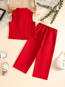 Flat lay of red two-piece suit with sleeveless lapel vest and wide-leg trousers