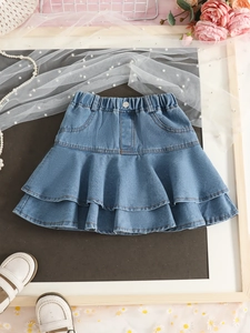 Girls denim tiered cake skirt with elastic waist and double layered ruffle hem in blue