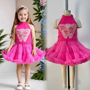 Detail of fuchsia girls tutu dress featuring sequin butterfly bodice and layered tulle skirt