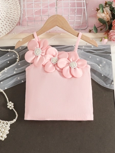 Pink rib-knit girls tank top with 3D floral appliques and white pearls on wooden hanger