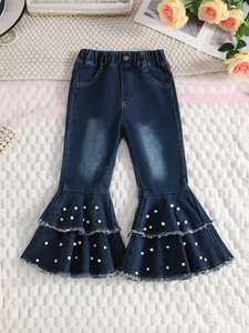 Girls dark blue flared denim pants with ruffle hem and decorative pearl embellishments