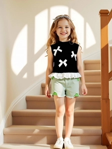 Girls summer set with black bow lace vest and light green washed denim shorts