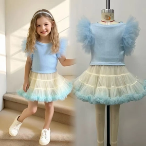 Detail of girls' light blue flutter sleeve top and gradient blue mesh tutu skirt set
