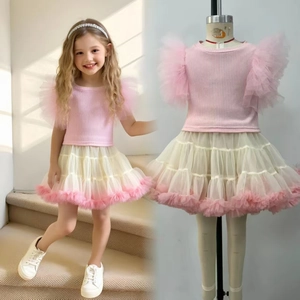 Detail of pink ruffled top and layered mesh tutu skirt for toddler girl summer outfit