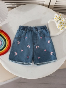Girls denim shorts with rainbow and heart embroidery featuring frayed edges and elastic waist