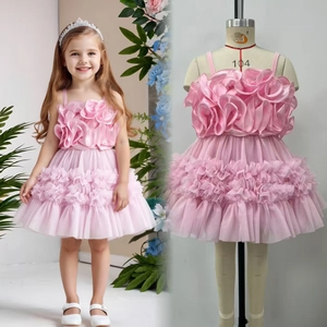 Detailed view of pink toddler tulle dress with 3D floral ruffles and layered hemline