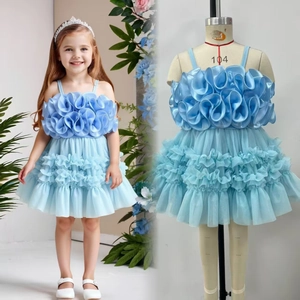Detail of light blue girls tulle dress with 3D pleated bodice and ruffled mesh skirt