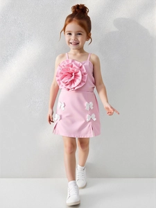 Pink two-piece set for girls featuring a 3D flower top and skirt with white bows