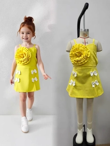 Yellow girls' summer set with a large 3D flower top and white bow-accented skirt