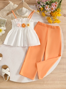Girls summer set with white floral camisole top and orange wide-leg pants