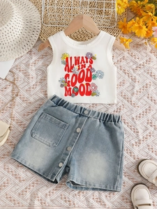 Girls' summer outfit featuring a white daisy graphic tank top and denim shorts set