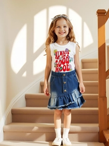 Girls' summer set with a white printed sleeveless tank top and ruffled denim skirt