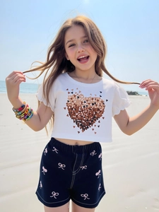 Girls summer outfit with white heart print t-shirt and blue bow pattern denim shorts
