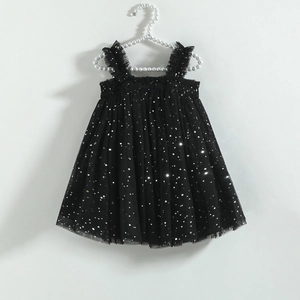 Close-up of black mesh tutu dress for girls with silver sequins and ruffled straps