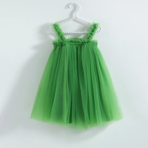 Detail of emerald green tulle dress with ruffled straps and a multilayered puffy skirt