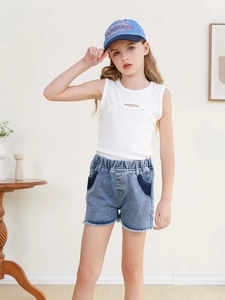 Girls' summer set with white cutout tank top and blue denim shorts with frayed hems