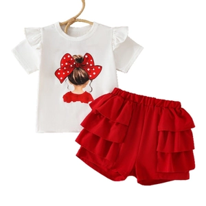 Detail of girls' white flutter sleeve tee and red tiered ruffle shorts with back-view print