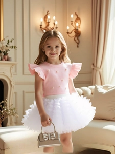 Pink pearl knitted T-shirt with ruffled sleeves and white tiered tutu skirt with handbag