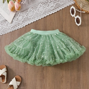 Close-up of mint green tutu skirt with silver star patterns and layered soft mesh fabric