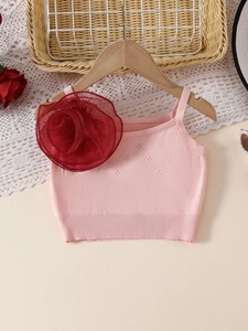 Pink girls knitted tank top featuring a large 3D mesh rose and hollow-out knit pattern