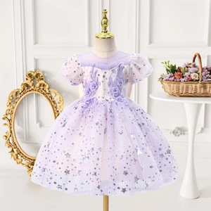 Detail of lavender princess dress with floral appliques and star sequins on mesh
