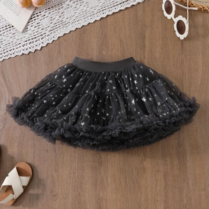 Detail of black tutu skirt for girls featuring silver stars and layered tulle fabric