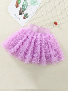 Light purple girls tutu skirt with tiered mesh tulle and elastic waistband on a flat lay