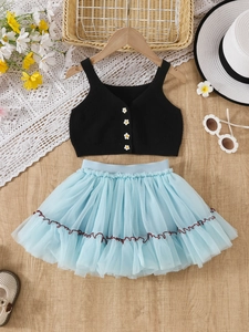 Completo bimba con top in maglia a margherita e gonna tutù in tulle azzurro a strati