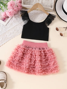 Detail view of girls black ruffled tank top and pink layered tutu tulle skirt set