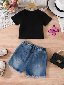 Kids summer set with black cotton t-shirt and light blue denim shorts with frayed hems