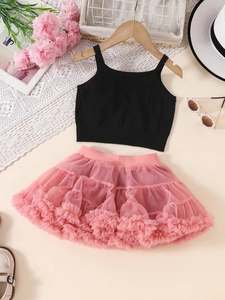 Girls 2-piece outfit featuring black knit camisole and pink layered mesh tutu skirt