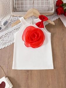 White sleeveless girls top with 3D red rose and bow decoration on wooden hanger